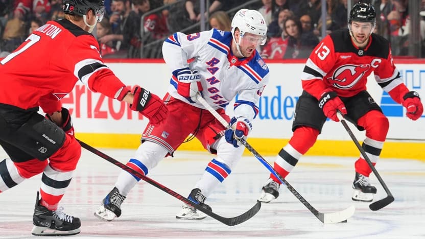 2/7/2026 Prudential Center, Newark, NJ., Alexis Lafreniere skates between two devils Players. Mandatory Credit: New York Rangers