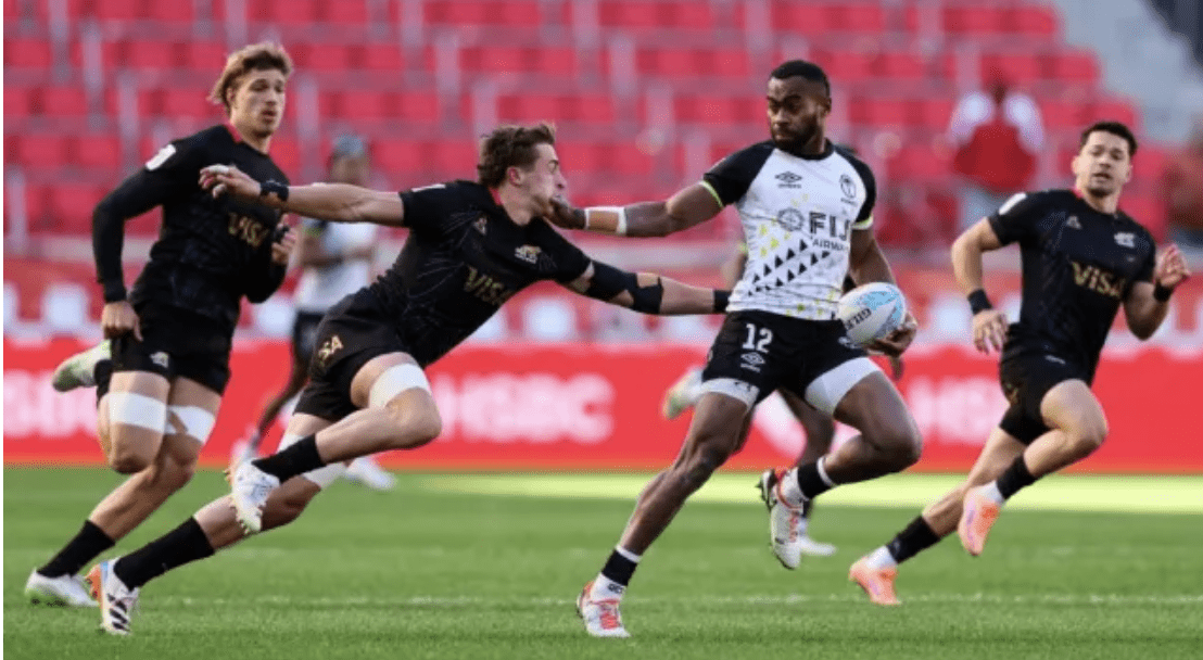Fiji’s Vuiviwa Naduvalo fends off Argentina’s Martiniano Arrieta during an HSBC SVNS Series pool play match at Sports Illustrated Stadium in Harrison, New Jersey.