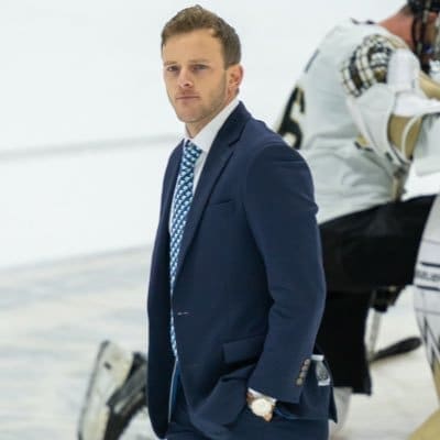 LIU men’s hockey head coach Brendan Riley stands at center ice inside Tate Rink at West Point, honoring the legacy of his father, longtime Army coach Brian Riley. He took over for his cousin Brett Riley.