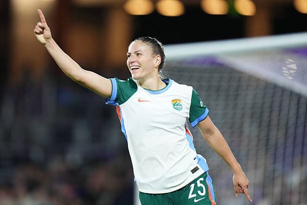 Denver Summit FC forward Melissa Kössler raises her arm in celebration after scoring during the match against the Orlando Pride at Inter&Co Stadium.