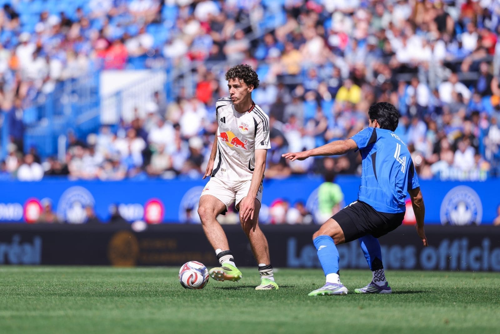 Adri Mehmeti with the ball facing a defender