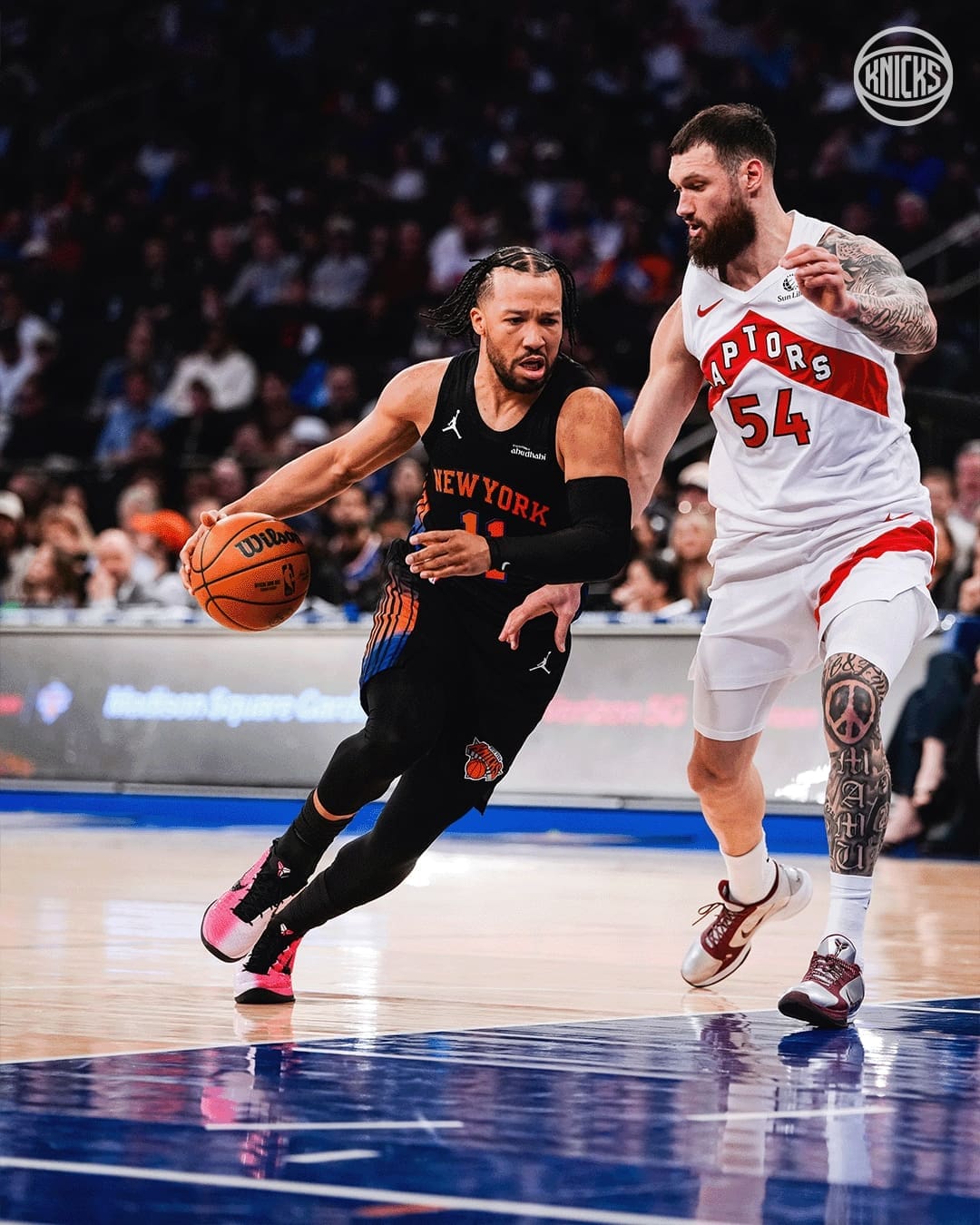 Jalen Brunson challenging the Raptors in the paint