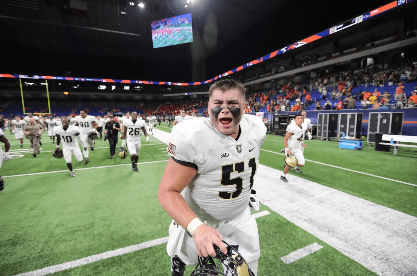 Army center Brady Small running off the field following a victory over UTSA; photo credit: Danny Wild-Imagn Images