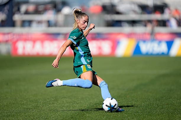 Denver Summit FC midfielder Janine Sonis strikes the ball during the NWSL match against Bay FC at PayPal Park.