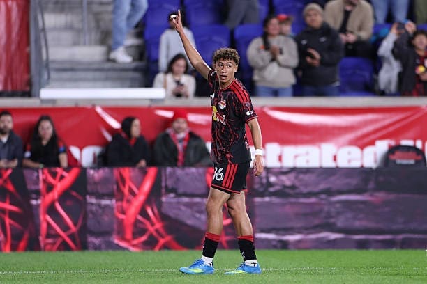 Julian Hall standing on the field and looks to signal for the ball