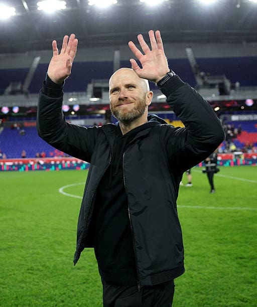 Michael Bradley sees his family after the win