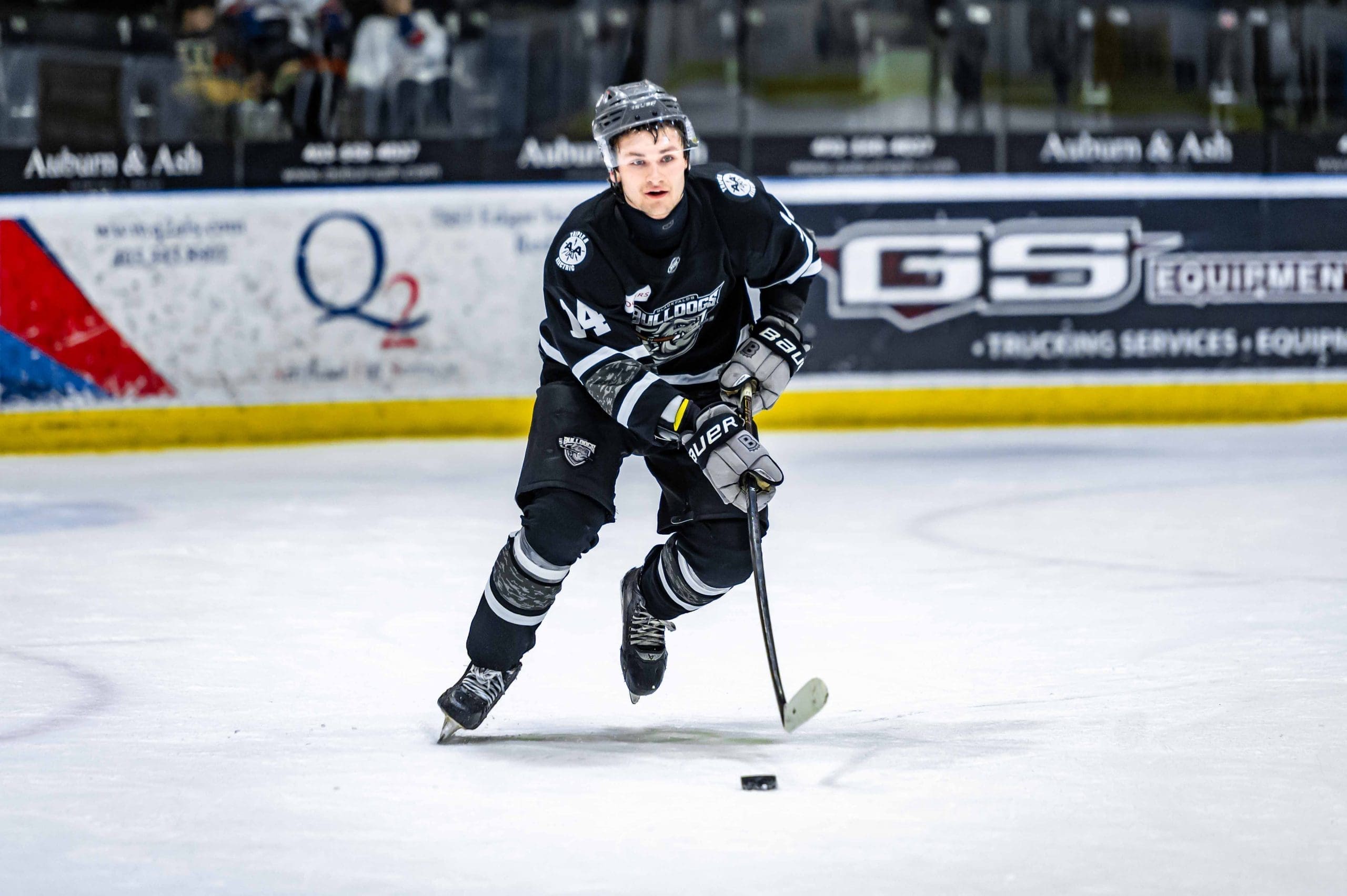 Thomas Neu skating with the puck playing for the Blackfalds Bulldogs; 02/28/26; Photo Credit: Tom Grimsdale/Ideal Images Red Deer