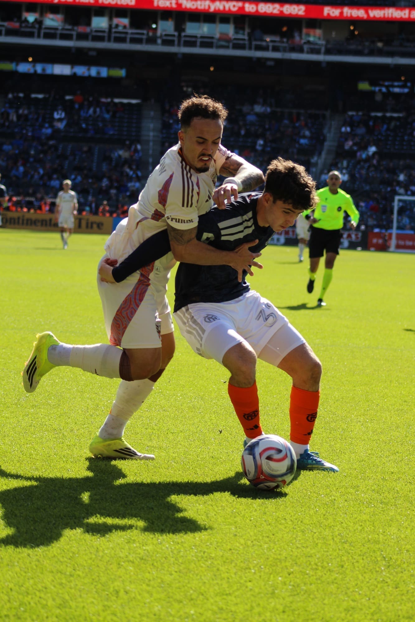 D.C. United’s Brandon Servania battles NYCFC’s Jonathan Shore for the ball near the sideline during an MLS match at Citi Field.