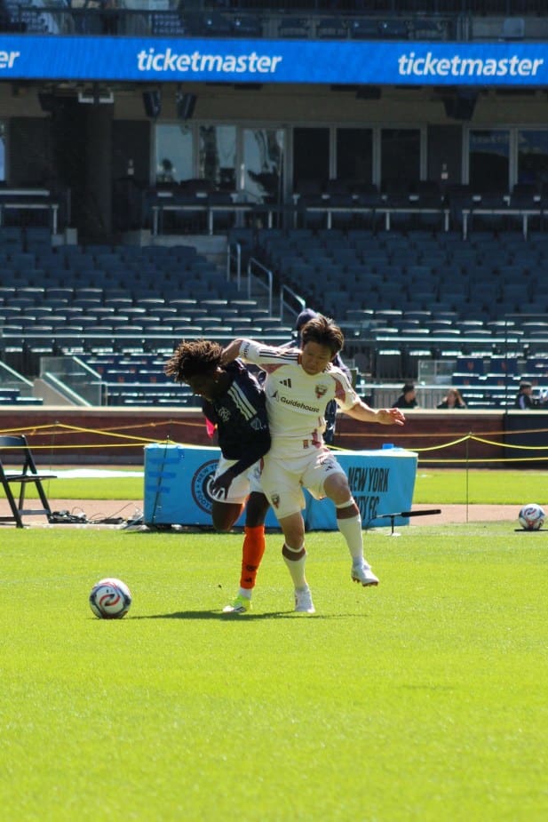 D.C. United left wingback Keisuke Kurokawa fouls NYCFC forward Malachi Jones during an MLS match at Citi Field.