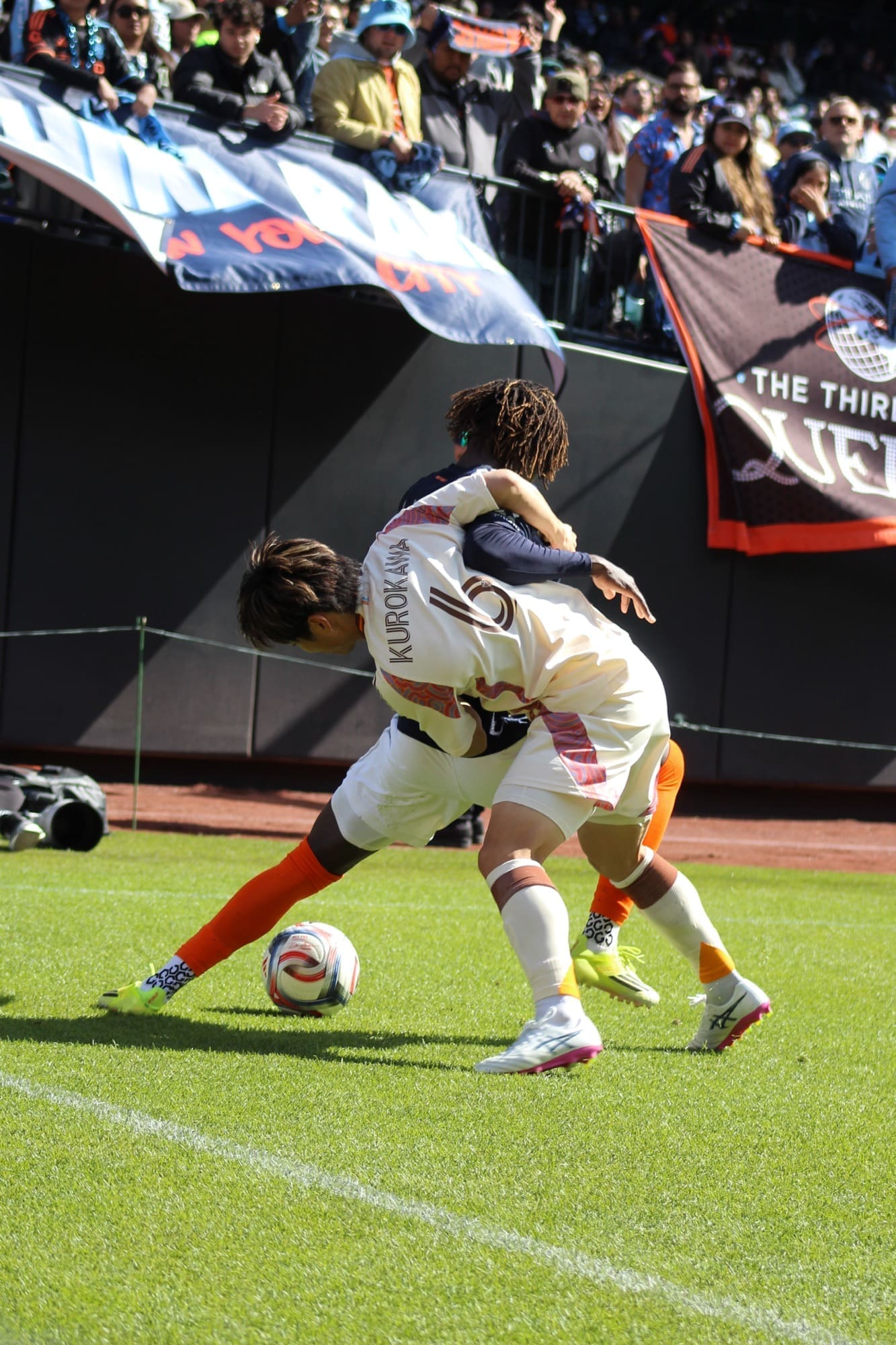 D.C. United left wingback Keisuke Kurokawa fouls NYCFC forward Malachi Jones near the sideline during an MLS match at Citi Field.