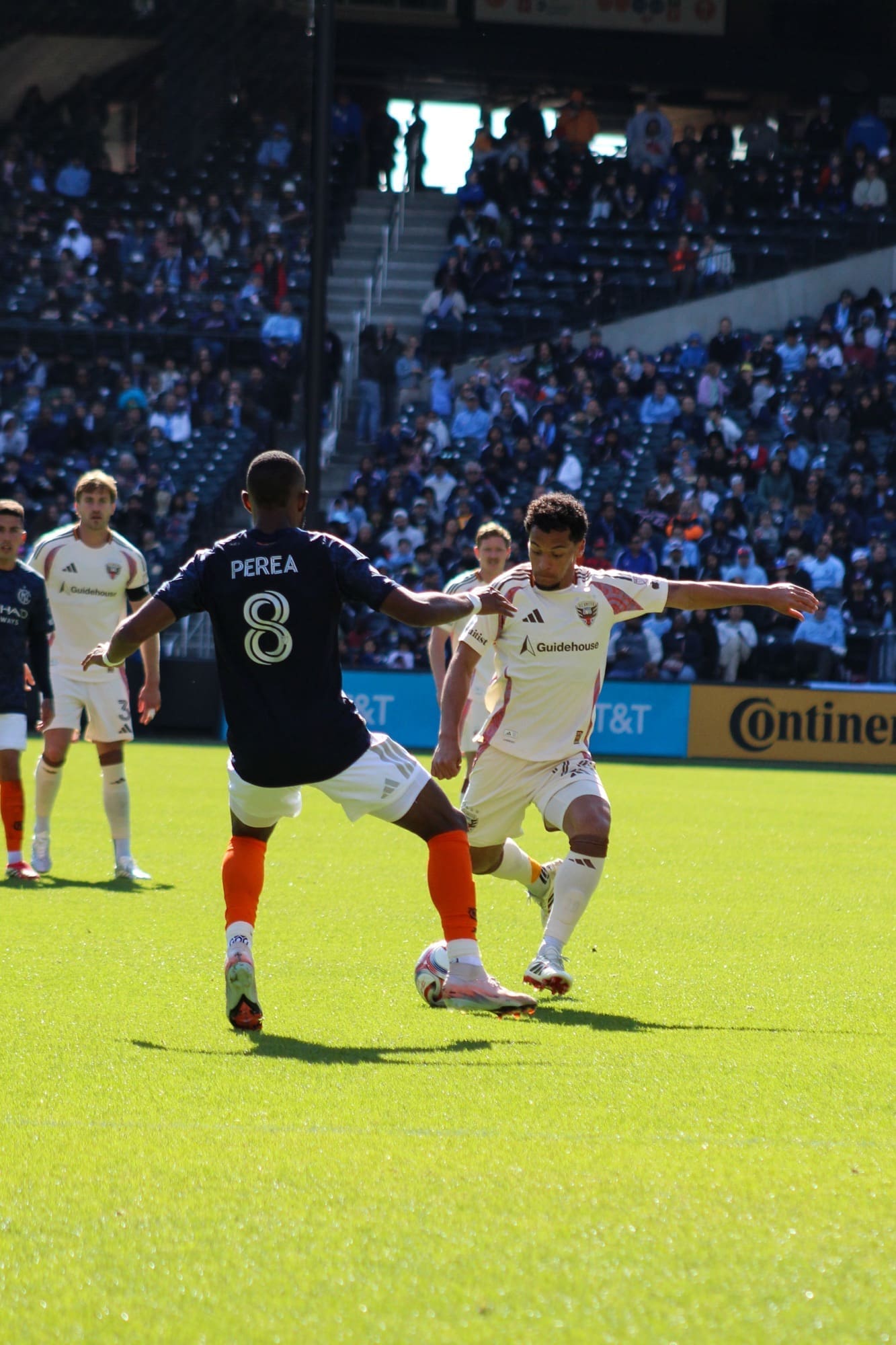 D.C. United’s Brandon Servania attempts a shot while NYCFC midfielder Andrés Perea defends during an MLS match at Citi Field.