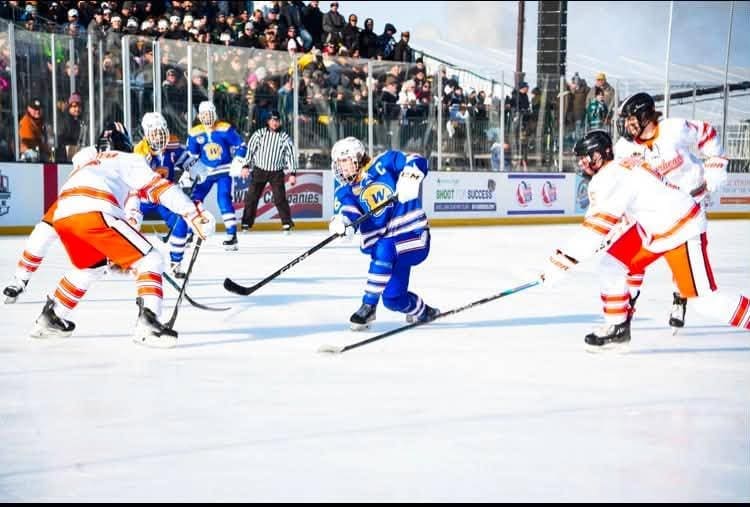 Cade De St. Hubert playing an outdoor game for the Wayzata Trojans; Photo Credit: Wayzata High School