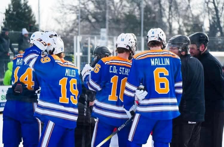 Cade De St. Hubert and Rhys Wallin playing an outdoor game for the Wayzata Trojans; Photo Credit: Wayzata High School