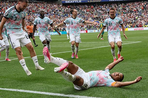 Youri Tielemans on the ground in celebration