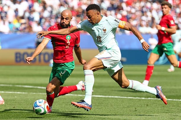Klyian Mbappe is about to be tackled